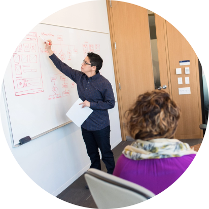 Man at white board