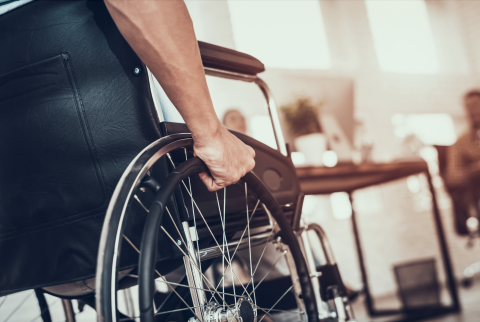 Hands on Wheelchair Wheel